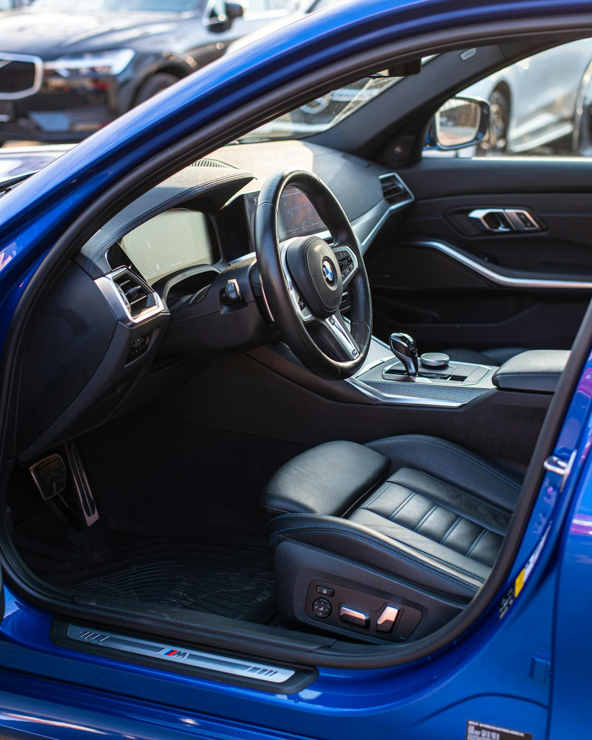 Spotless car interior with black leather seats and dashboard after a detail